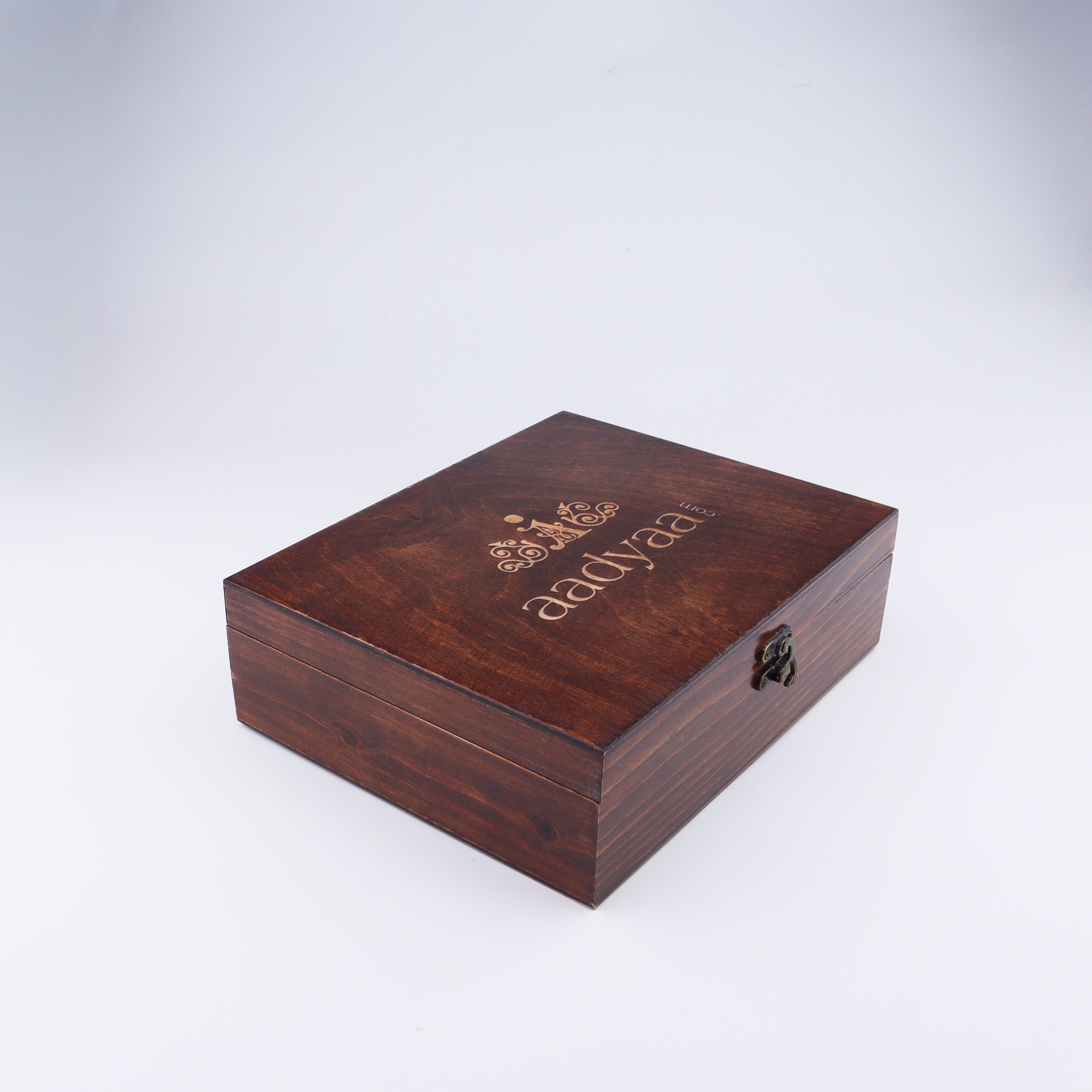 Closed wooden jewelry box with logo