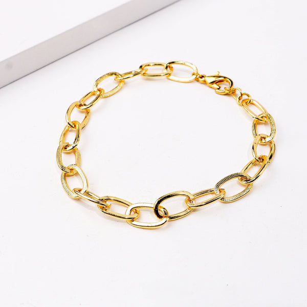 Close-up of a 22K gold-plated fashion bracelet showcasing intricate detailing, fine craftsmanship, and rich 22K gold plating