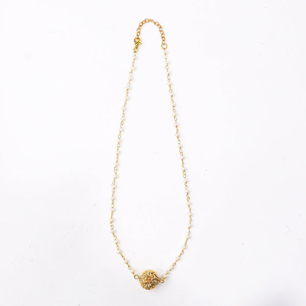 Detailed view of a 22K gold-plated fashion necklace highlighting intricate motifs, textured detailing, and a premium 22K gold-plated finish