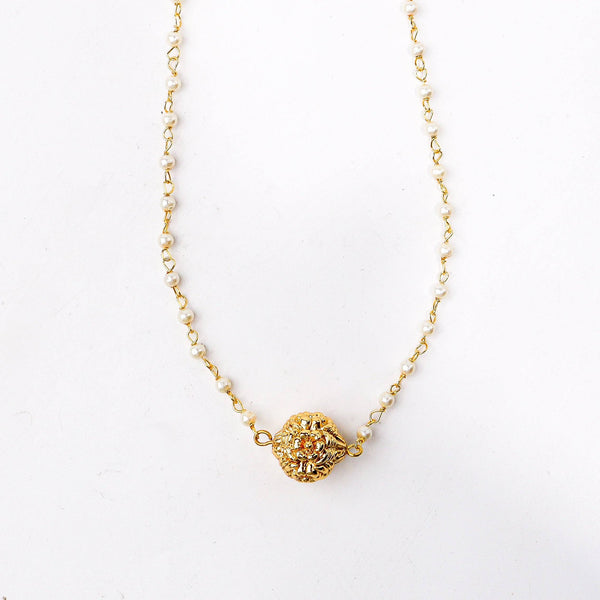 Close-up of a 22K gold-plated fashion necklace showcasing intricate detailing, fine craftsmanship, and rich 22K gold plating