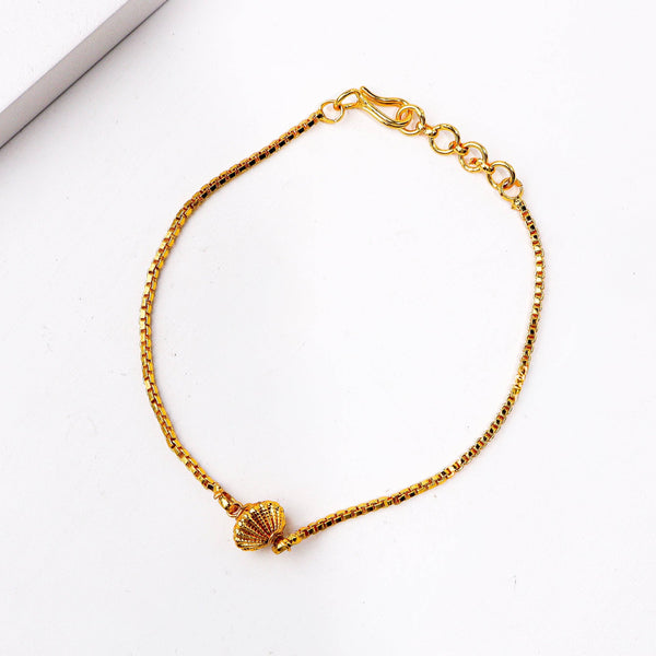 Detailed view of a 22K gold-plated fashion bracelet highlighting intricate motifs, textured detailing, and a premium 22K gold-plated finish