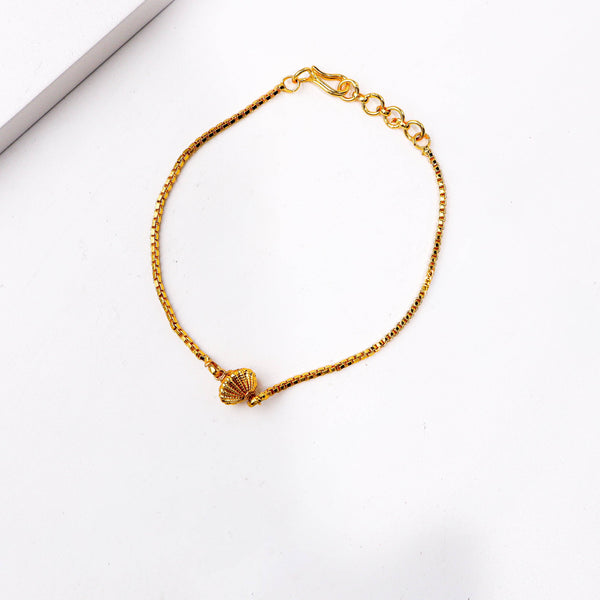 Angled view of a 22K gold-plated fashion bracelet highlighting its elegant structure, unique design, and polished gold finish