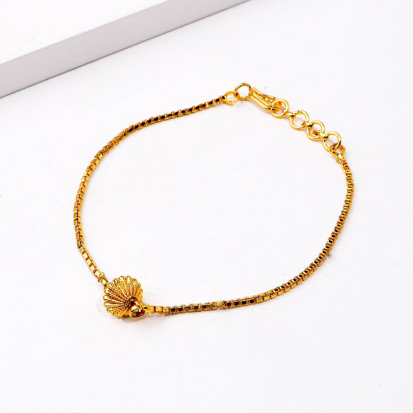 Close-up of a 22K gold-plated fashion bracelet showcasing intricate detailing, fine craftsmanship, and rich 22K gold plating