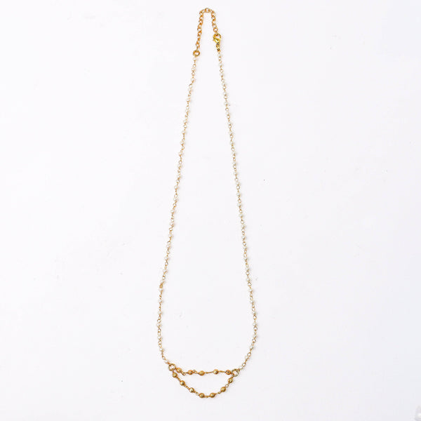 Detailed view of a 22K gold-plated fashion necklace highlighting intricate motifs, textured detailing, and a premium 22K gold-plated finish