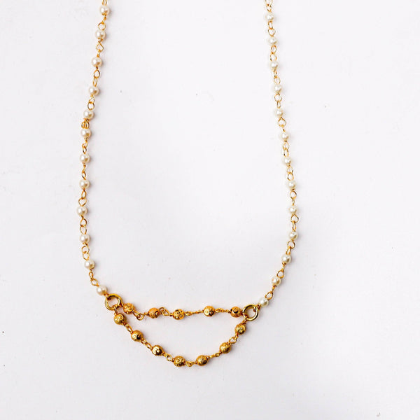 Close-up of a 22K gold-plated fashion necklace showcasing intricate detailing, fine craftsmanship, and rich 22K gold plating