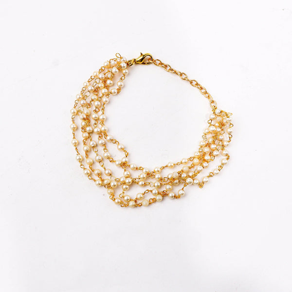 Angled view of a 22K gold-plated fashion bracelet highlighting its elegant structure, unique design, and polished gold finish