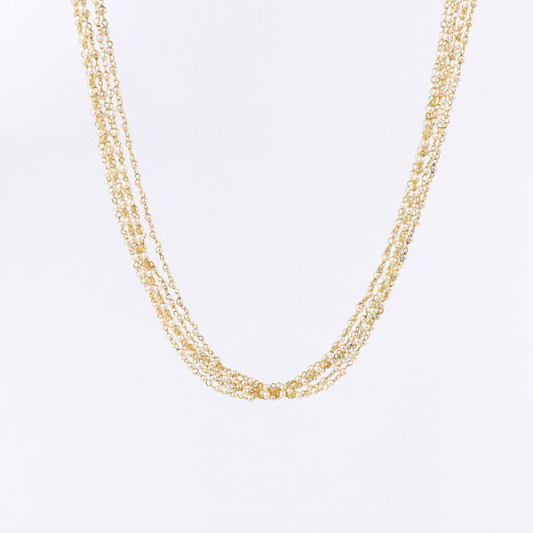 Close-up of a 22K gold-plated fashion necklace showcasing intricate detailing, fine craftsmanship, and rich 22K gold plating