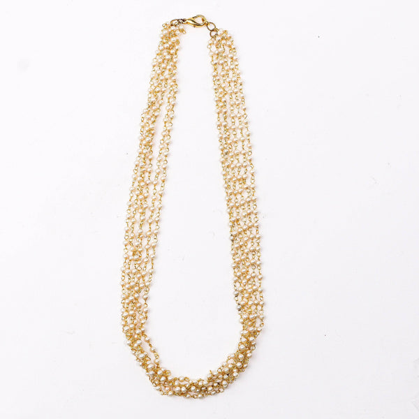 Detailed view of a 22K gold-plated fashion necklace highlighting intricate motifs, textured detailing, and a premium 22K gold-plated finish