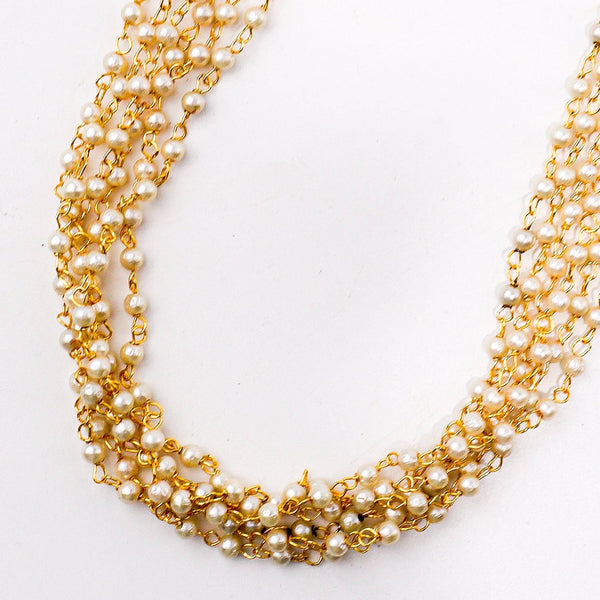 Close-up of a 22K gold-plated fashion necklace showcasing intricate detailing, fine craftsmanship, and rich 22K gold plating