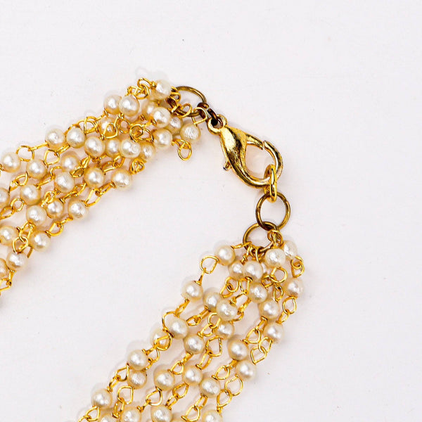 Angled view of a 22K gold-plated fashion necklace highlighting its elegant structure, unique design, and polished gold finish