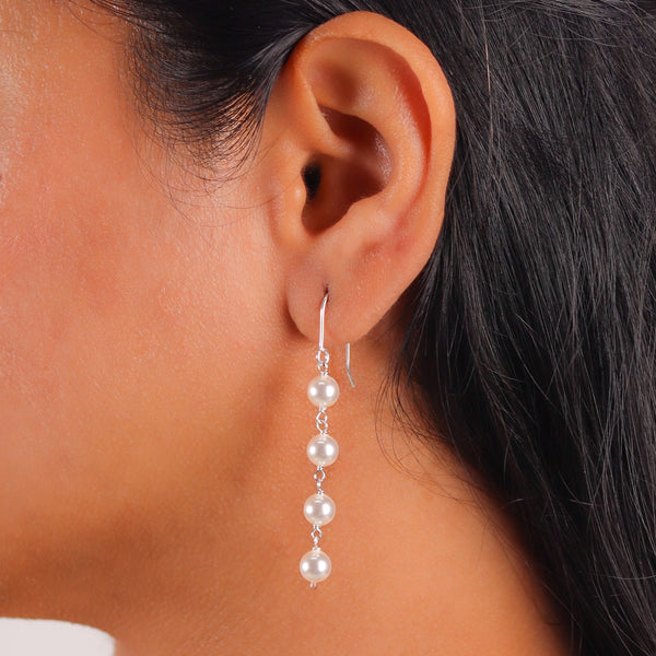 Close-up of Pearl Dangling Earring with lustrous pearl detail