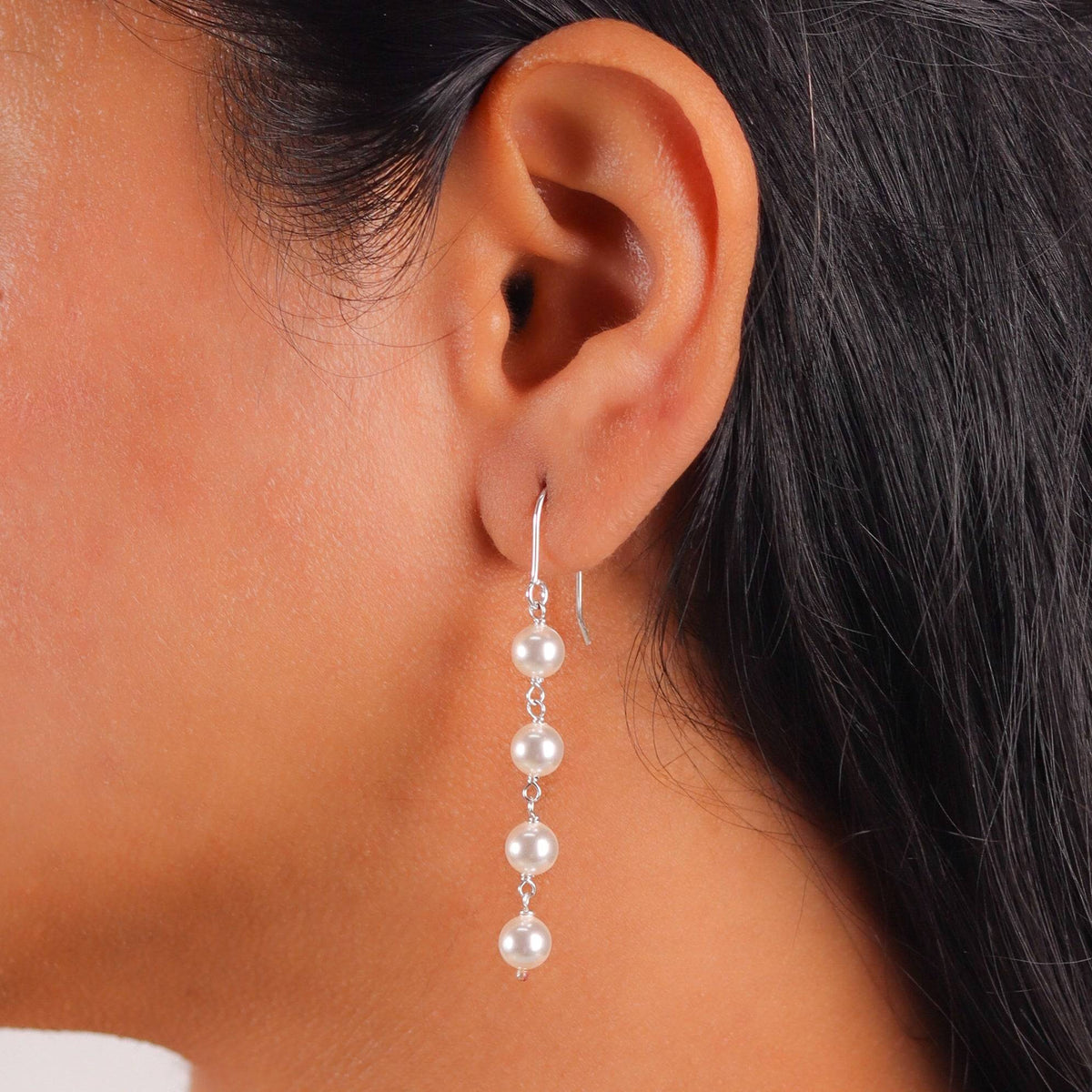 Close-up of Pearl Dangling Earring with lustrous pearl detail