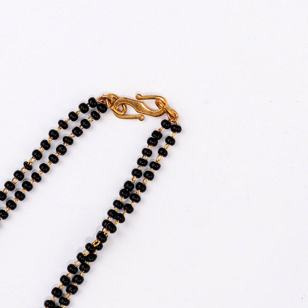 Angled view of a 22K gold-plated fashion mangalsutra highlighting its elegant structure, unique design, and polished gold finish