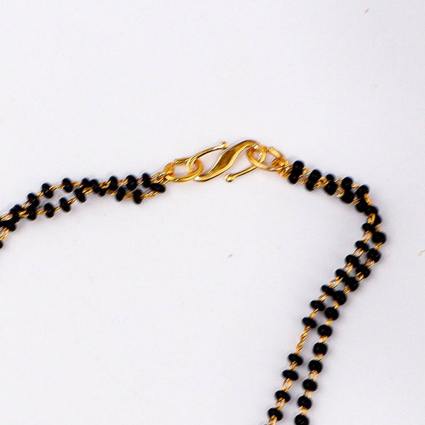 Angled view of a 22K gold-plated fashion mangalsutra highlighting its elegant structure, unique design, and polished gold finish