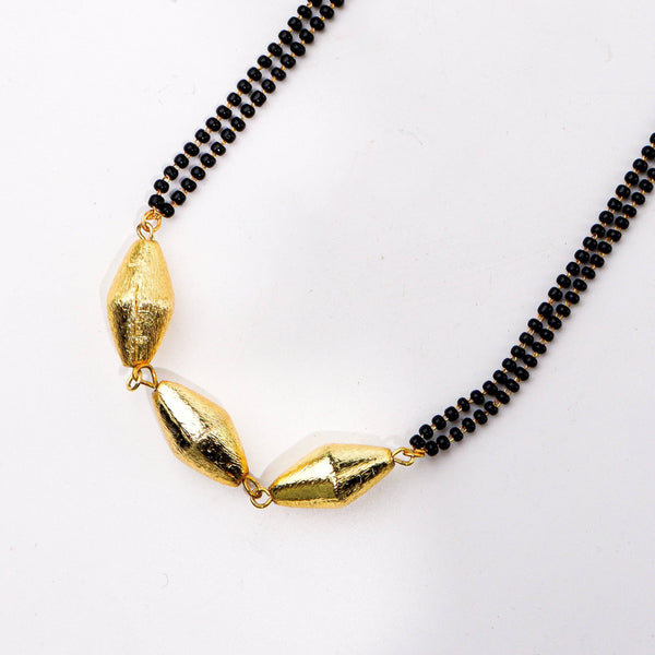 Angled view of a 22K gold-plated fashion mangalsutra highlighting its elegant structure, unique design, and polished gold finish