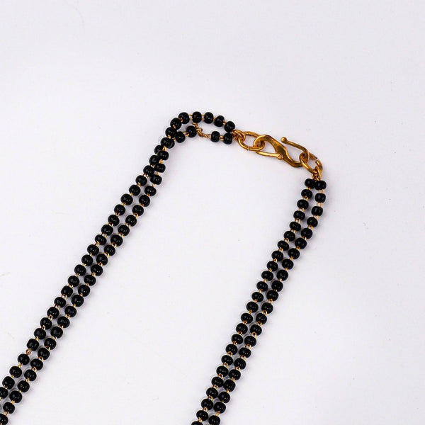 Angled view of a 22K gold-plated fashion mangalsutra highlighting its elegant structure, unique design, and polished gold finish