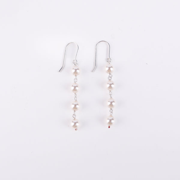 Angled side view of Pearl Dangling Earring in silver