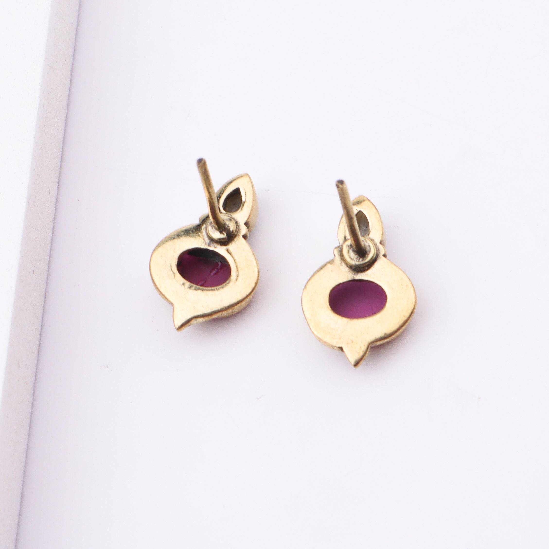 Angled view of Brass Fashion Earrings highlighting the unique silhouette, structure, and polished brass finish