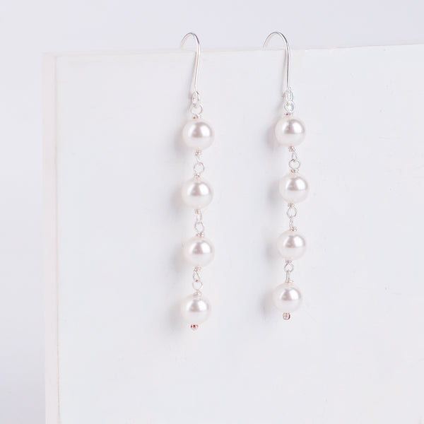Model wearing Pearl Dangling Earring for elegant look