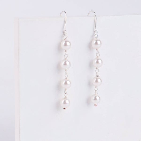 Model wearing Pearl Dangling Earring for elegant look