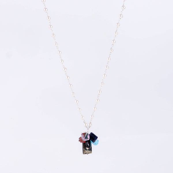Angled side view of multicolour gemstone necklace showing layered design and silver craftsmanship