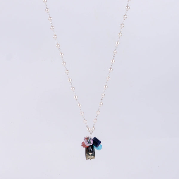 Angled side view of multicolour gemstone necklace showing layered design and silver craftsmanship