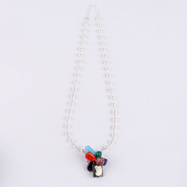 Macro detail of colorful gemstones and pearl Gantan on 92.5 sterling silver necklace