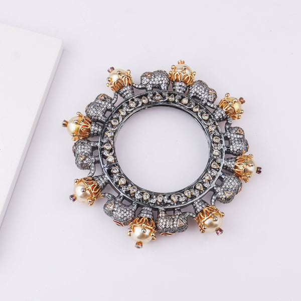 Angled view of 22K gold-plated fashion bangle (Single) highlighting its elegant structure and polished gold finish