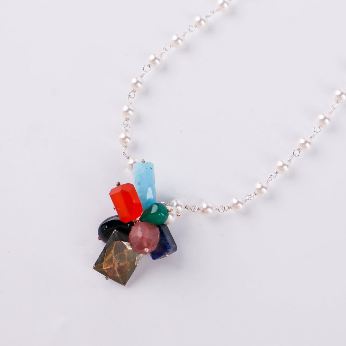 Model wearing multicolour stone bunch necklace with pearl Gantan for festive or wedding styling