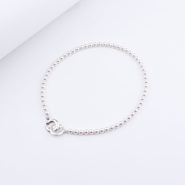 White pearl beaded necklace with silver clasp