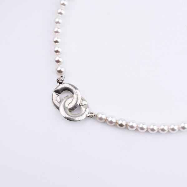 Pearl necklace on white background