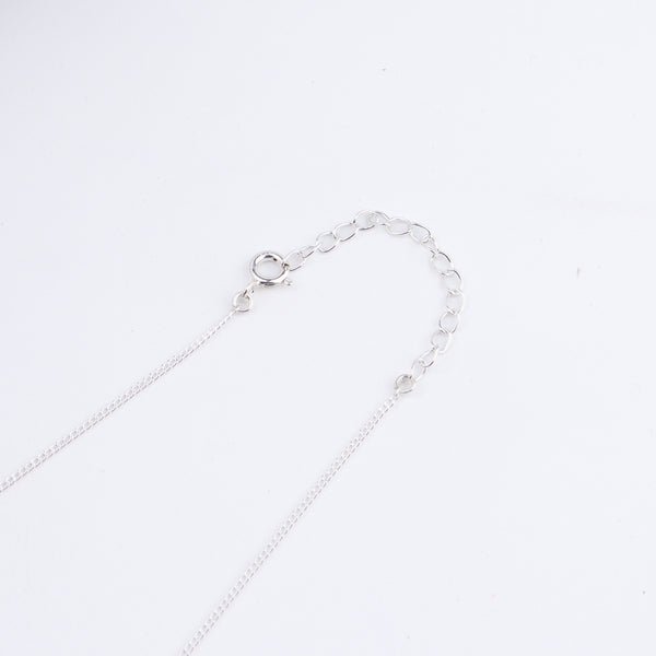 Flat lay of Classic CZ Flower Motif Mangalsutra Set with Ring Small