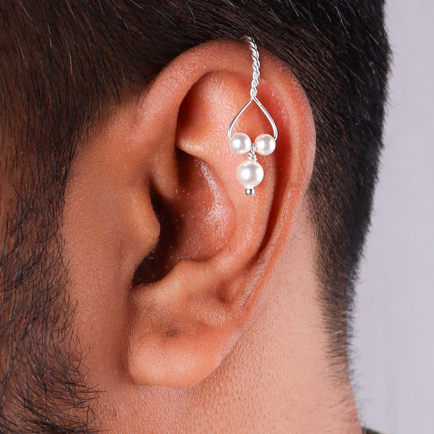 Woman wearing pearl clip-on earrings