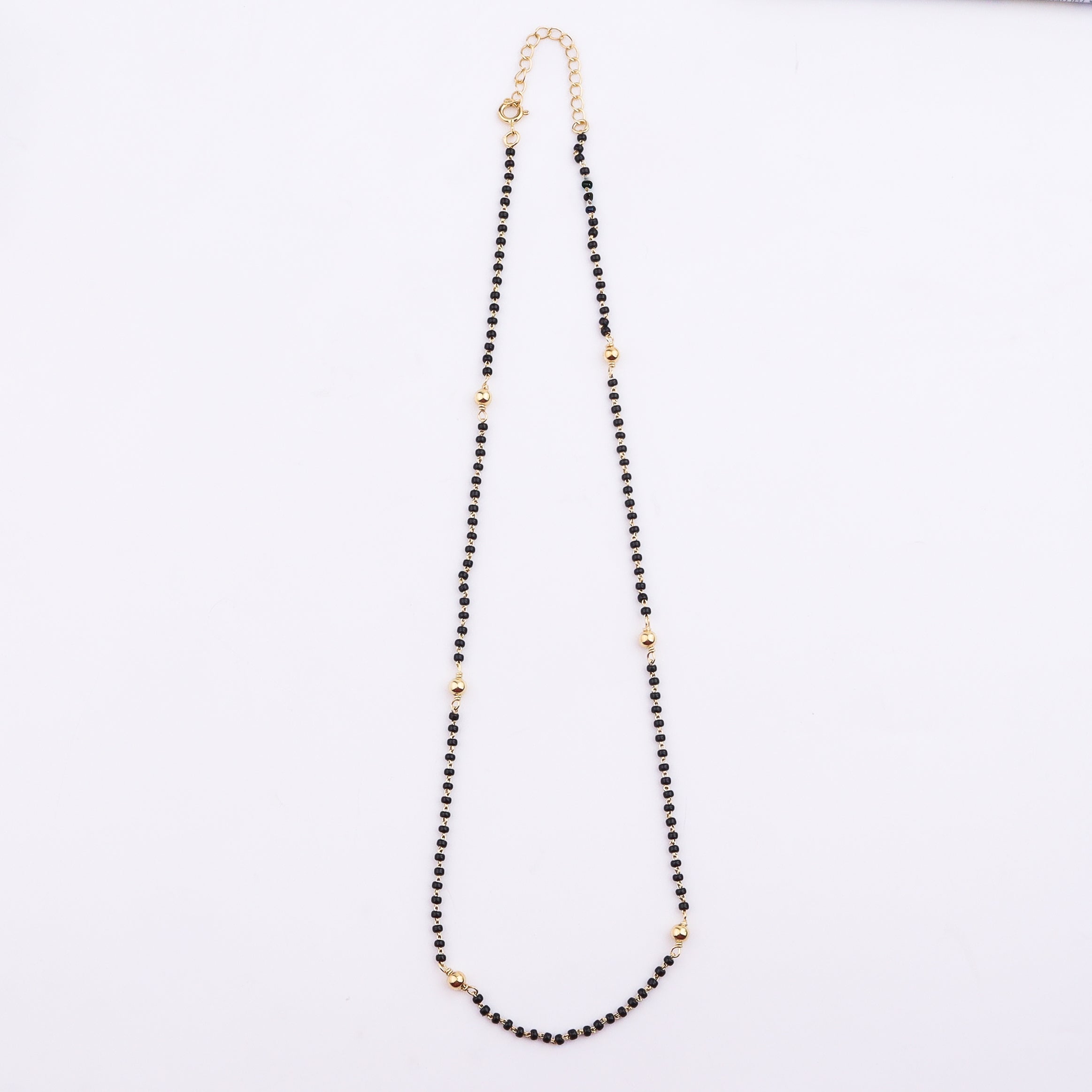 Gold and black beaded necklace