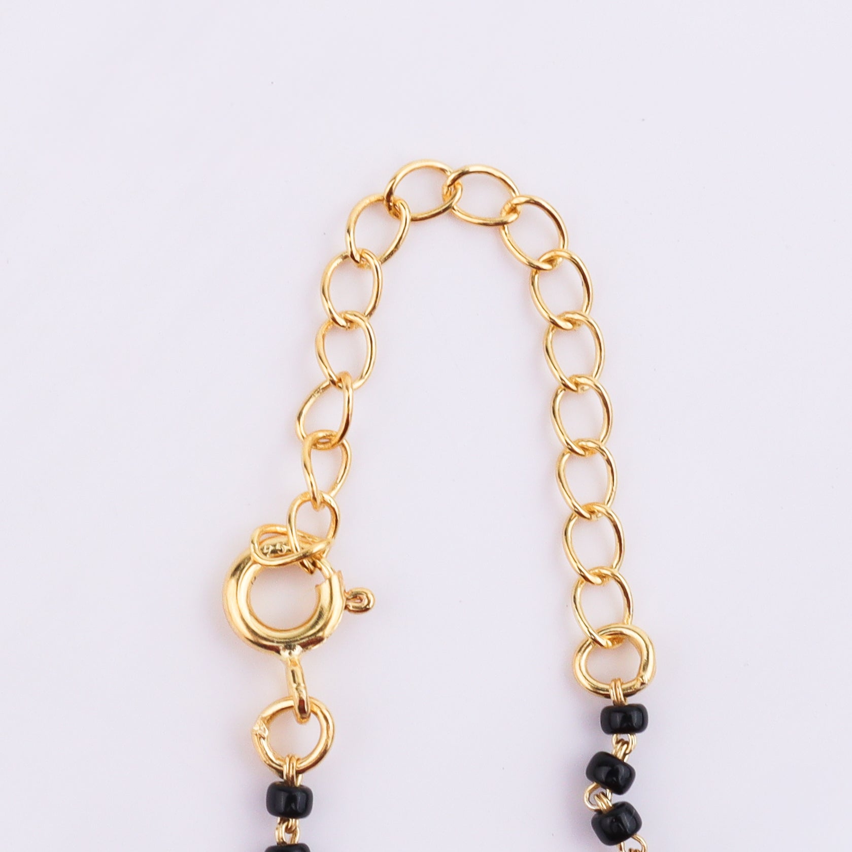 Gold Chain with Black Beads Close-up