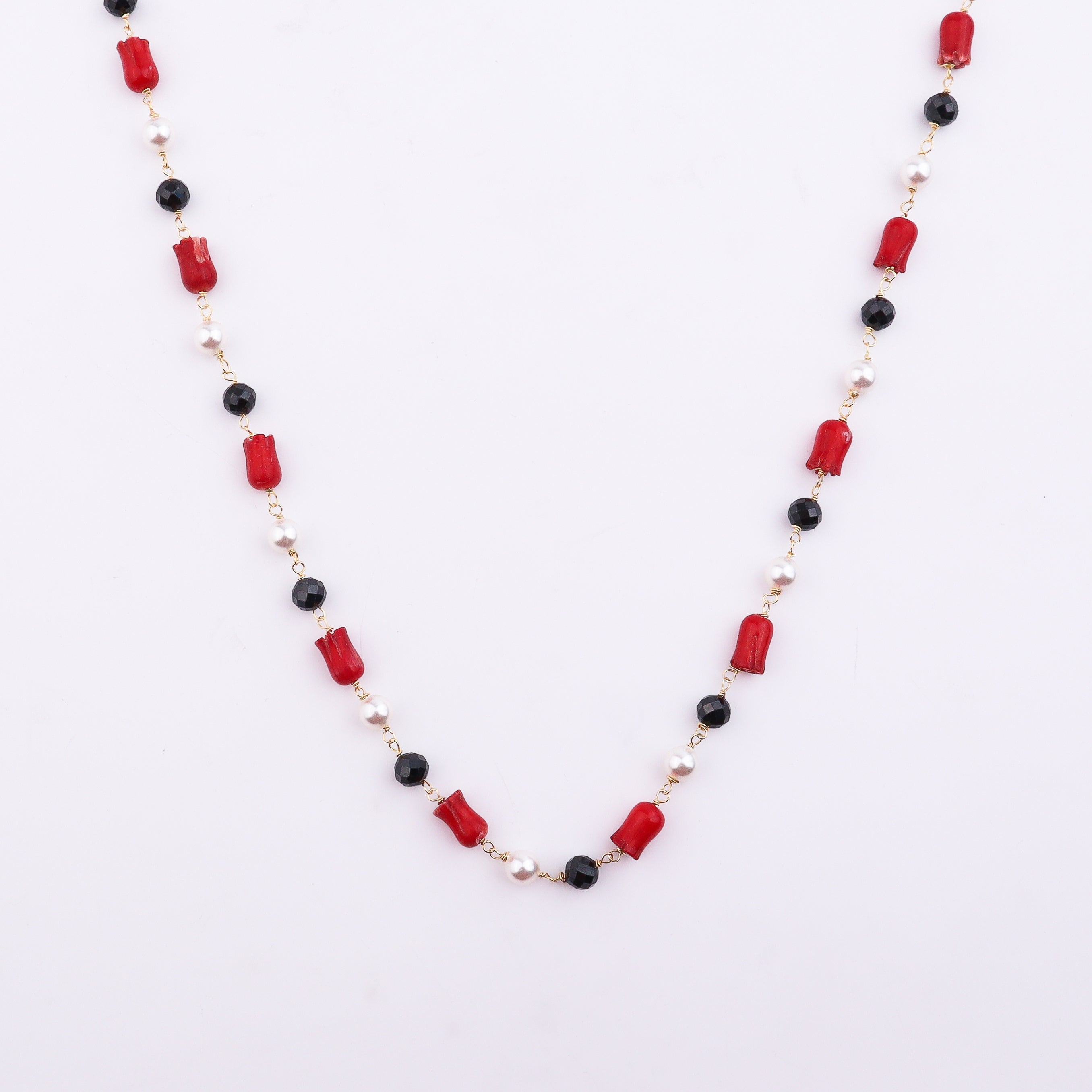 Red, black, and white beaded necklace with gold chain