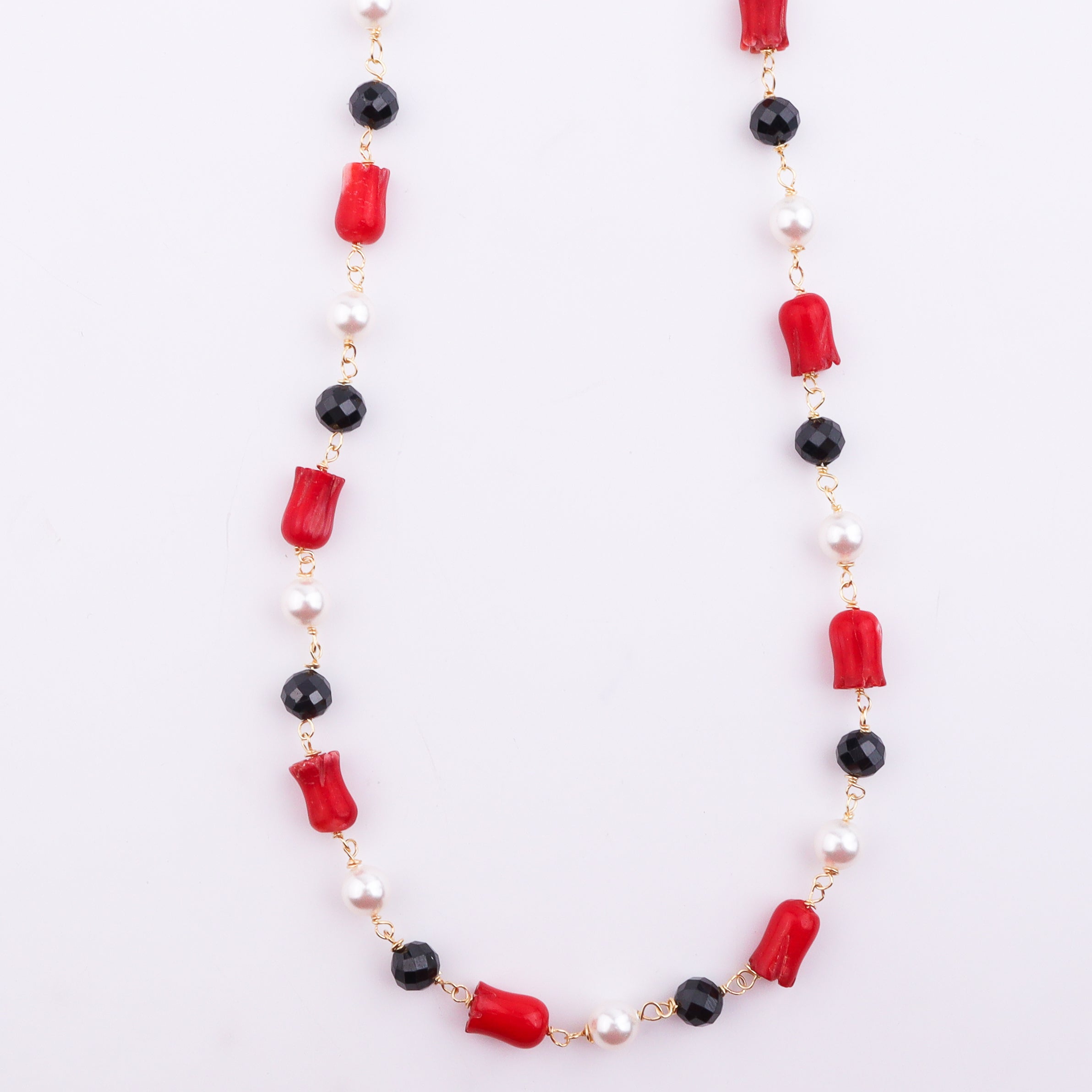 Detailed view of necklace beads and gold chain