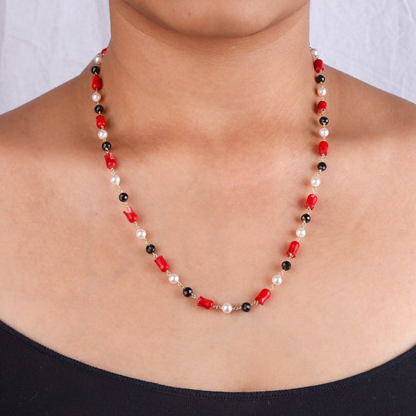 Close-up of beaded necklace on model's neck