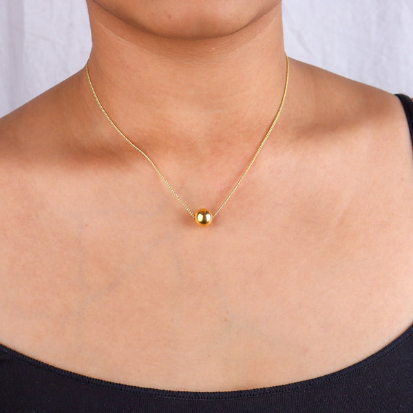 Gold chain necklace on model