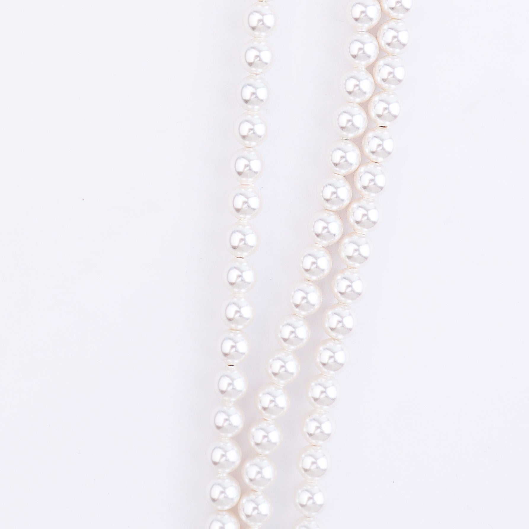 Red faceted beads and white pearls on silver chain