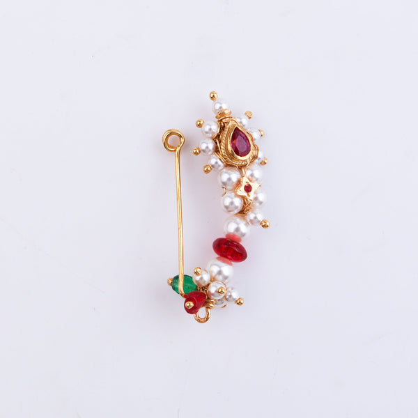Back view of pearl and red gemstone nose ring showing gold wire detail