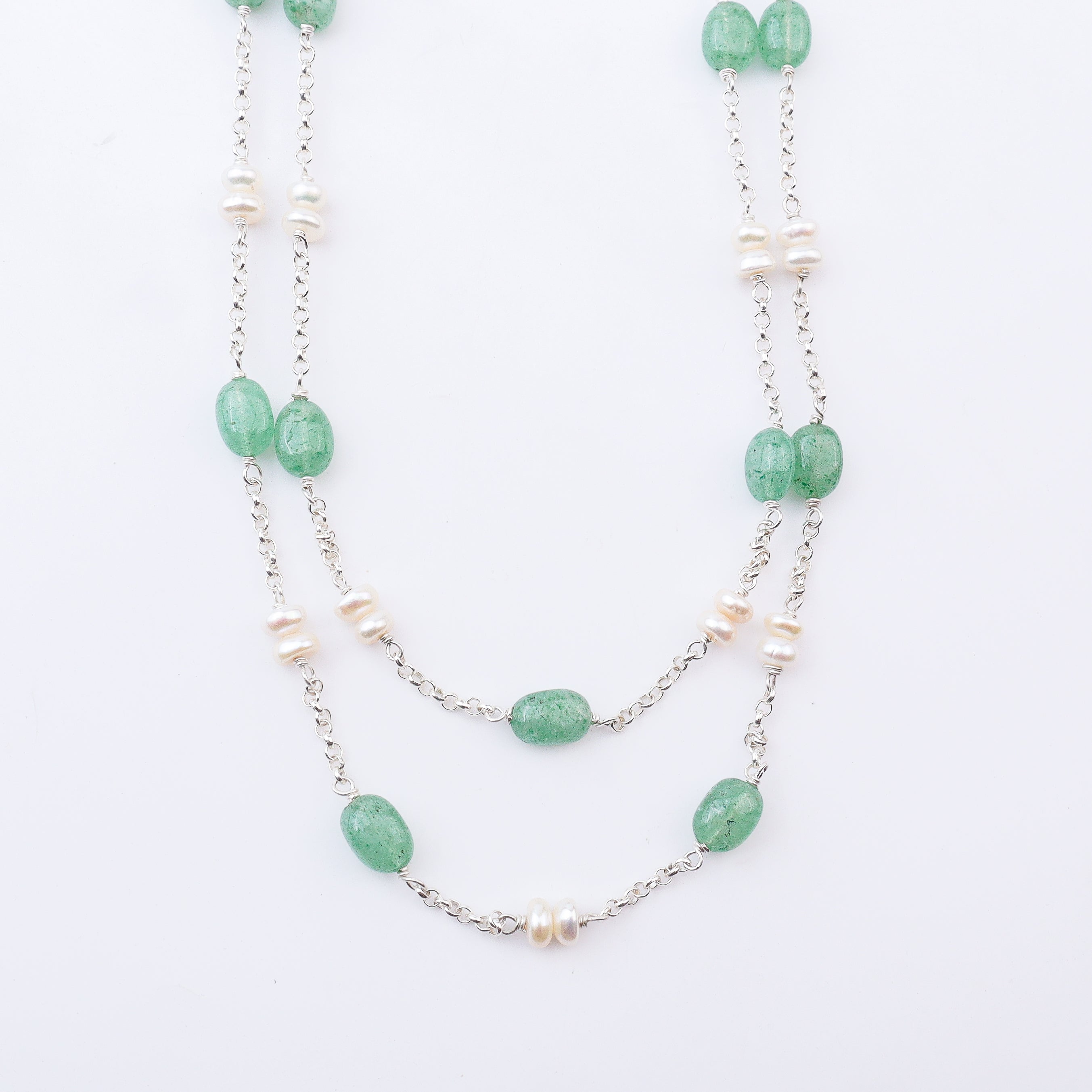 Close-up of silver chain necklace with green Russian Quartz and white freshwater pearls