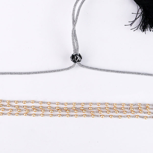 Macro detail of natural pearls with 22K gold plated 92.5 silver clasp and chain