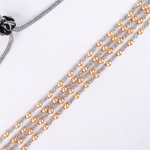 Model wearing golden pearl choker for festive and wedding styling