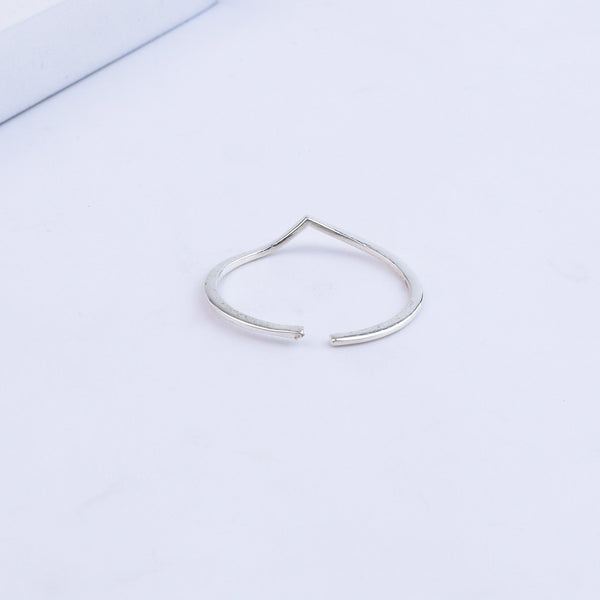 Silver open heart ring on white background