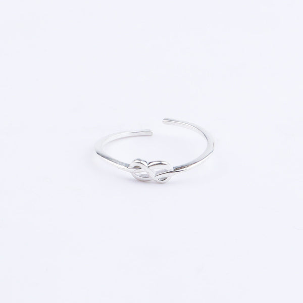 Silver infinity ring on white background