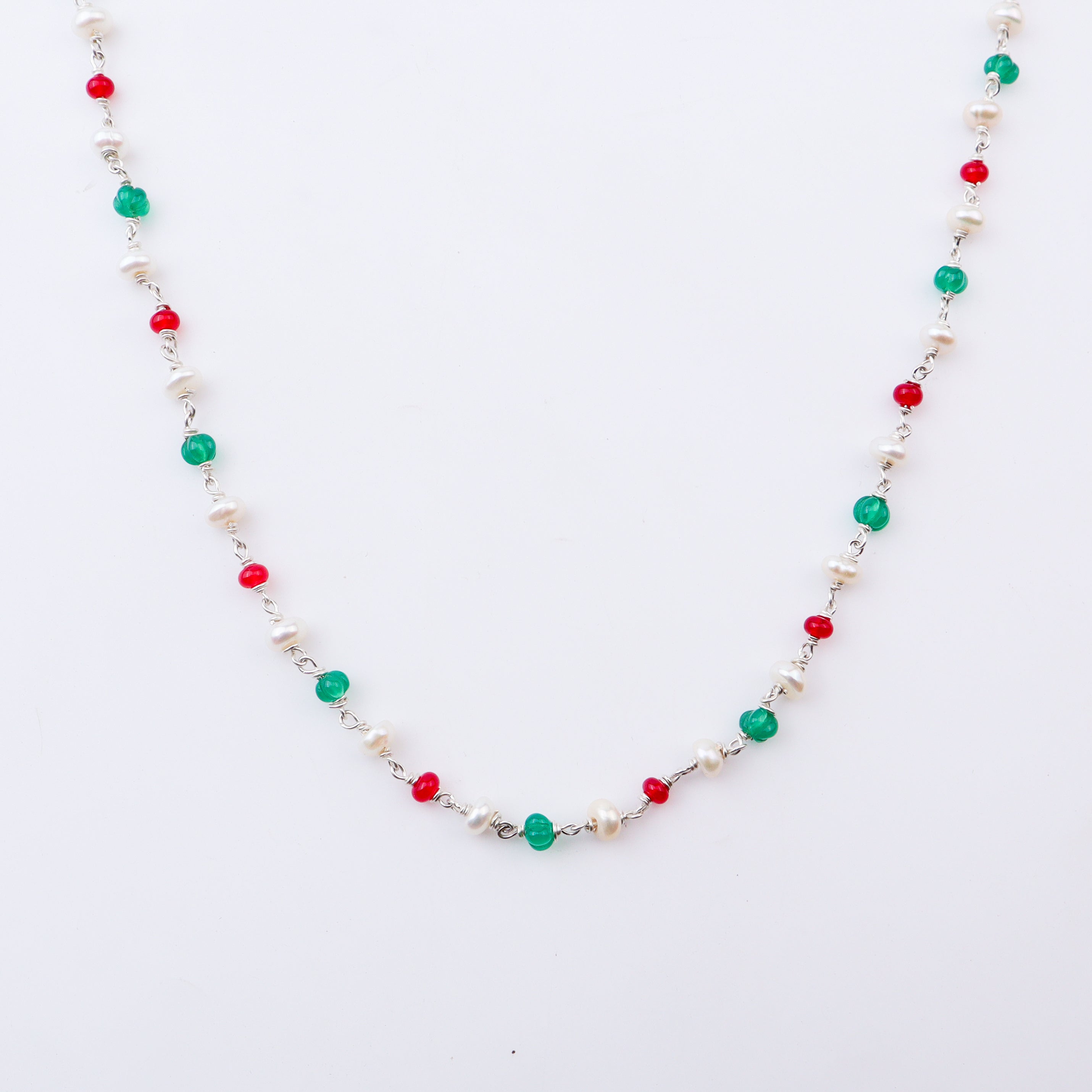 Colorful beaded necklace with pearls, red, green, and white beads