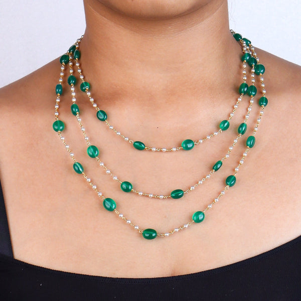 Necklace with green onyx and Swarovski pearls on model