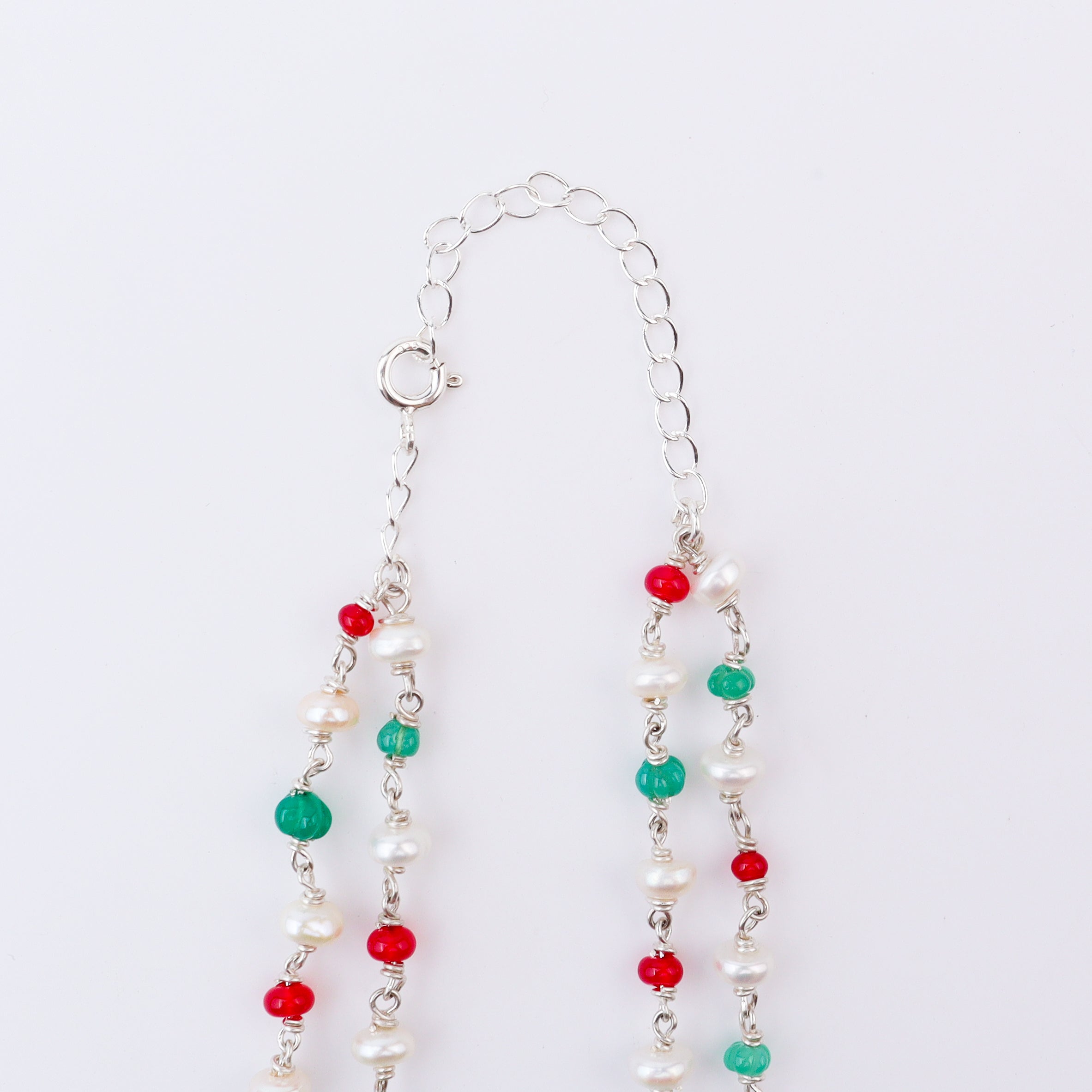 Silver beaded necklace with rubies, green onyx, and freshwater pearls