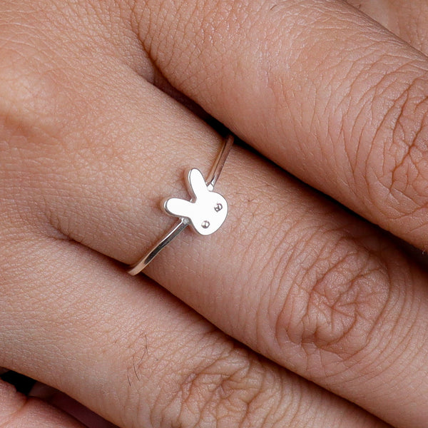 Close-up of bunny ring on finger